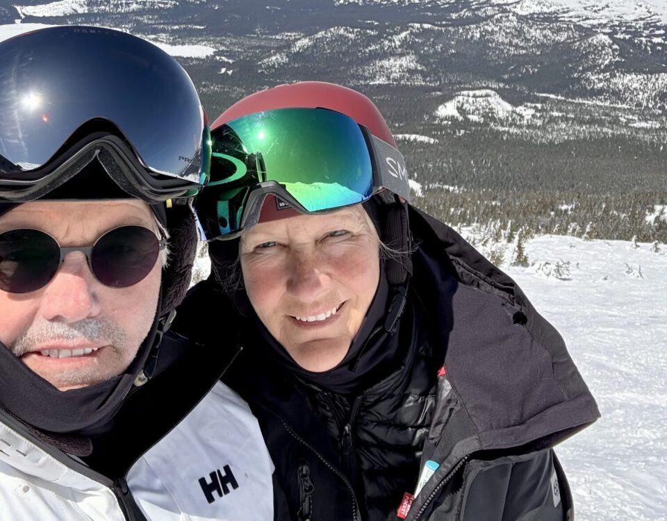 a selfie of peter and rochelle in ski gear on the mountain